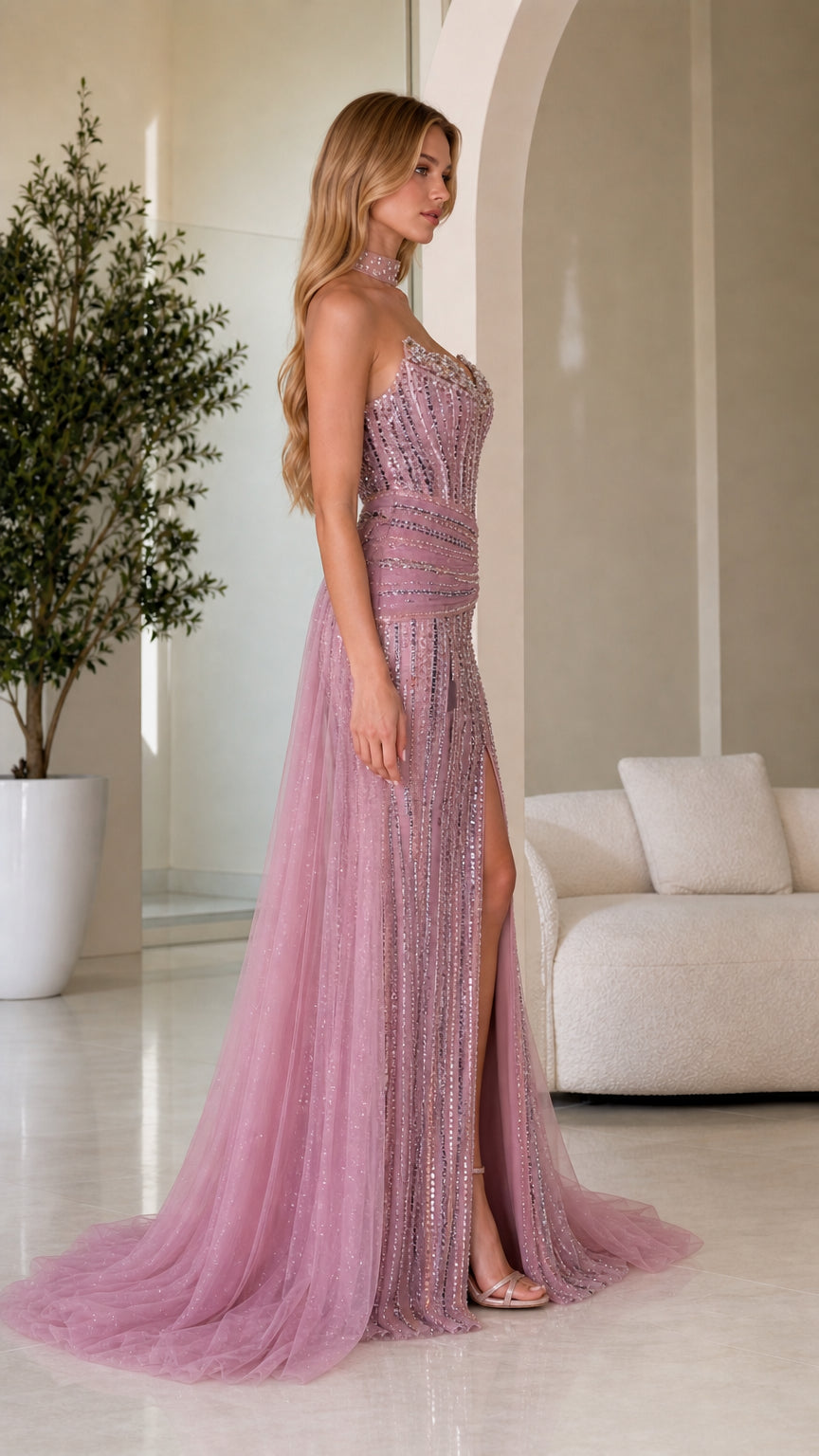 Side angle view of dusty rose formal gown showing thigh-high slit and sweep train