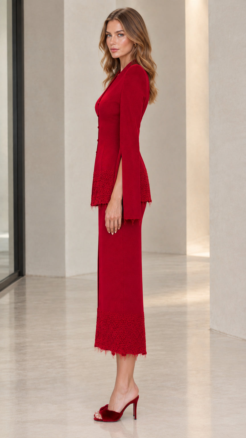 Side profile of woman in red peplum two-piece skirt set with split sleeves