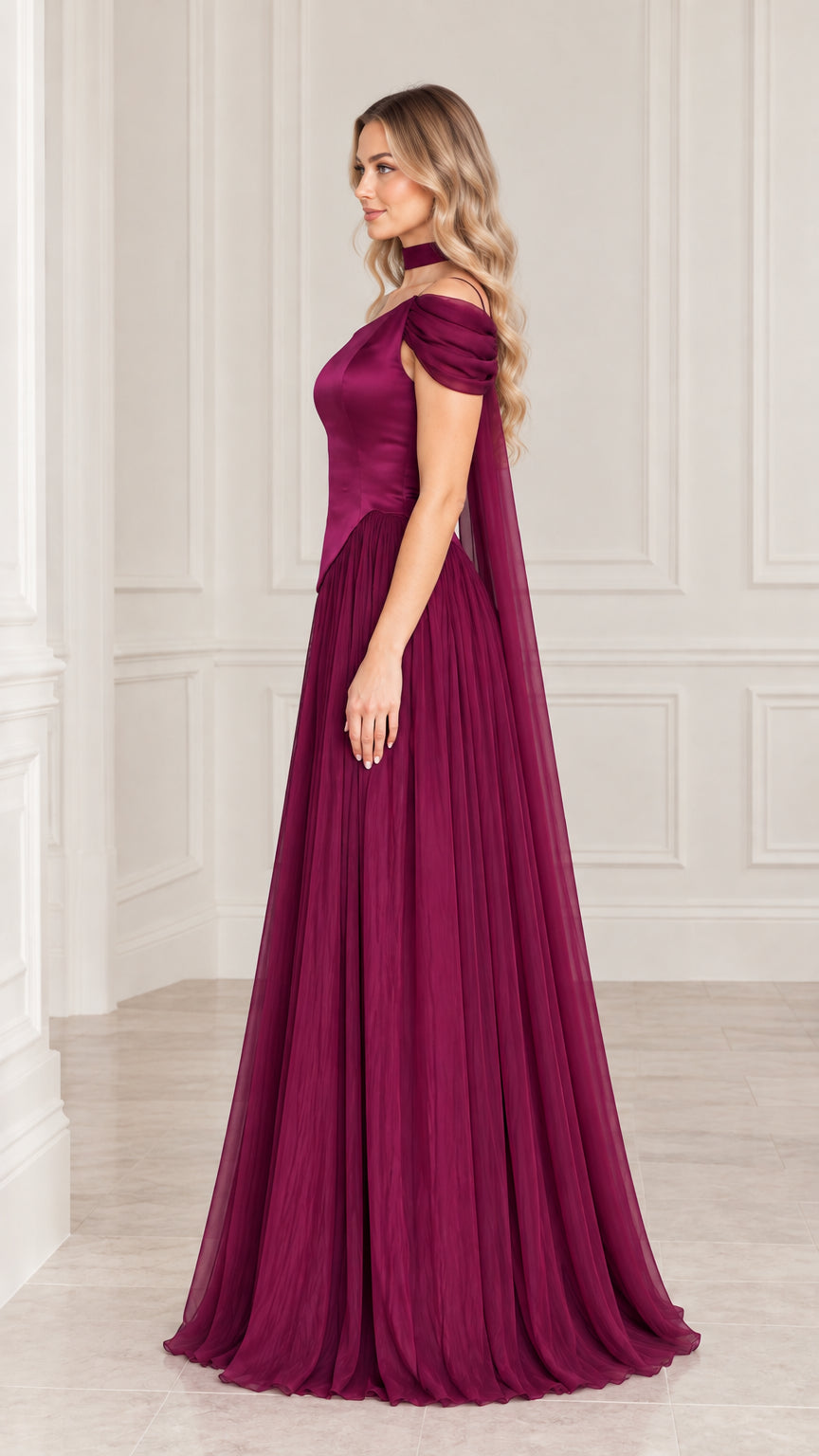 Side angle view of plum pleated formal maxi dress with cape detail