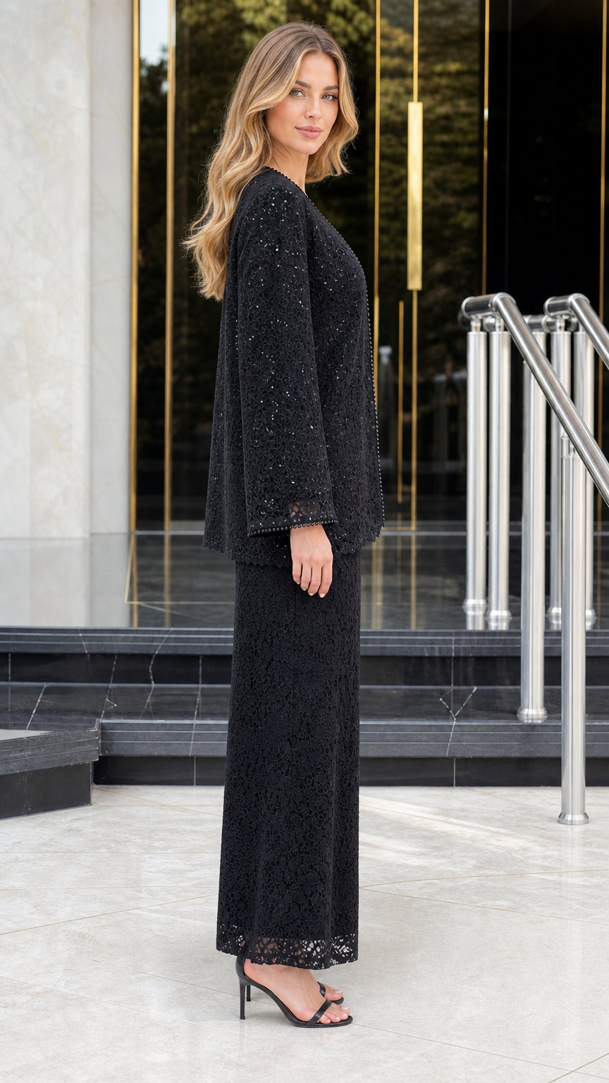 Side profile view of black beaded lace pant suit with wide sleeves