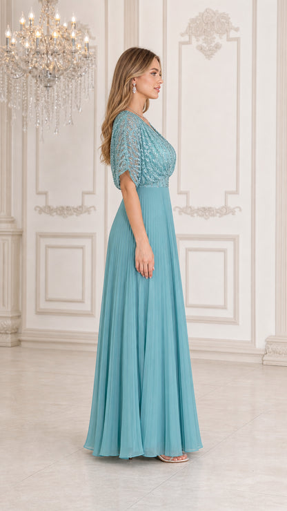 Side profile of woman wearing teal blue sequin pleated maxi gown