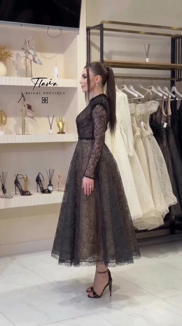 Side profile of black lace A-line evening dress on model