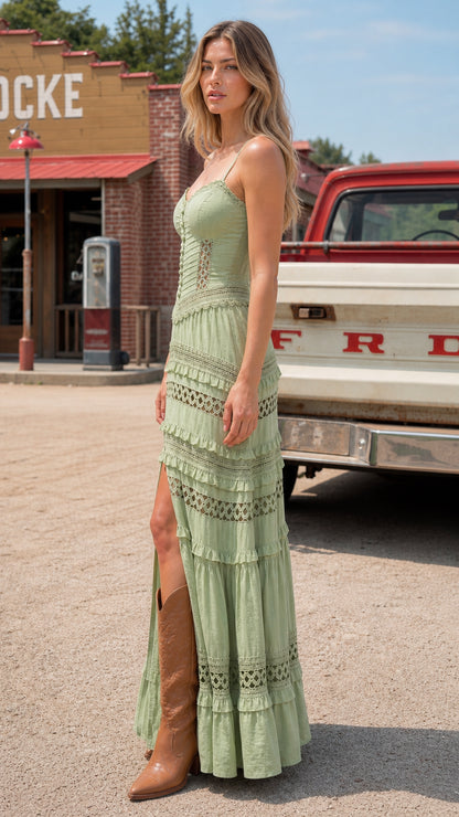 Side angle of model in Sage Green tiered maxi dress showing front slit detail