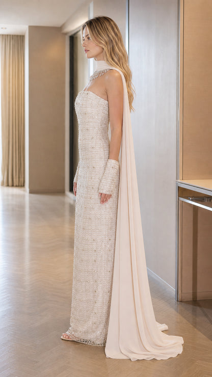 Side profile view of the Ivory White beaded evening gown showing the floor-length cape drape