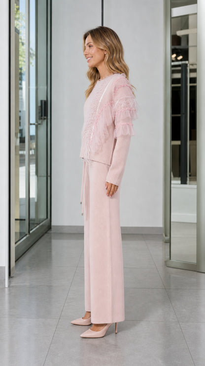 Side view of woman in Light Pink two-piece knit sweater and wide-leg trouser set