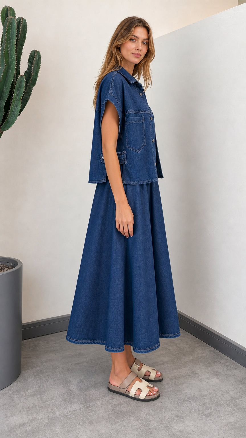Side profile of woman wearing Denim Blue button-down shirt and flowy A-line skirt set