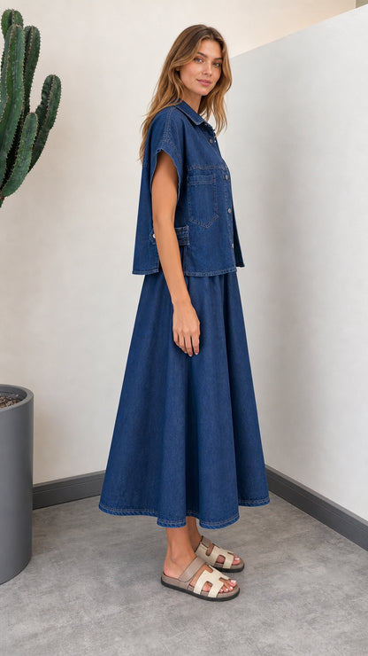 Side profile of woman wearing Denim Blue button-down shirt and flowy A-line skirt set