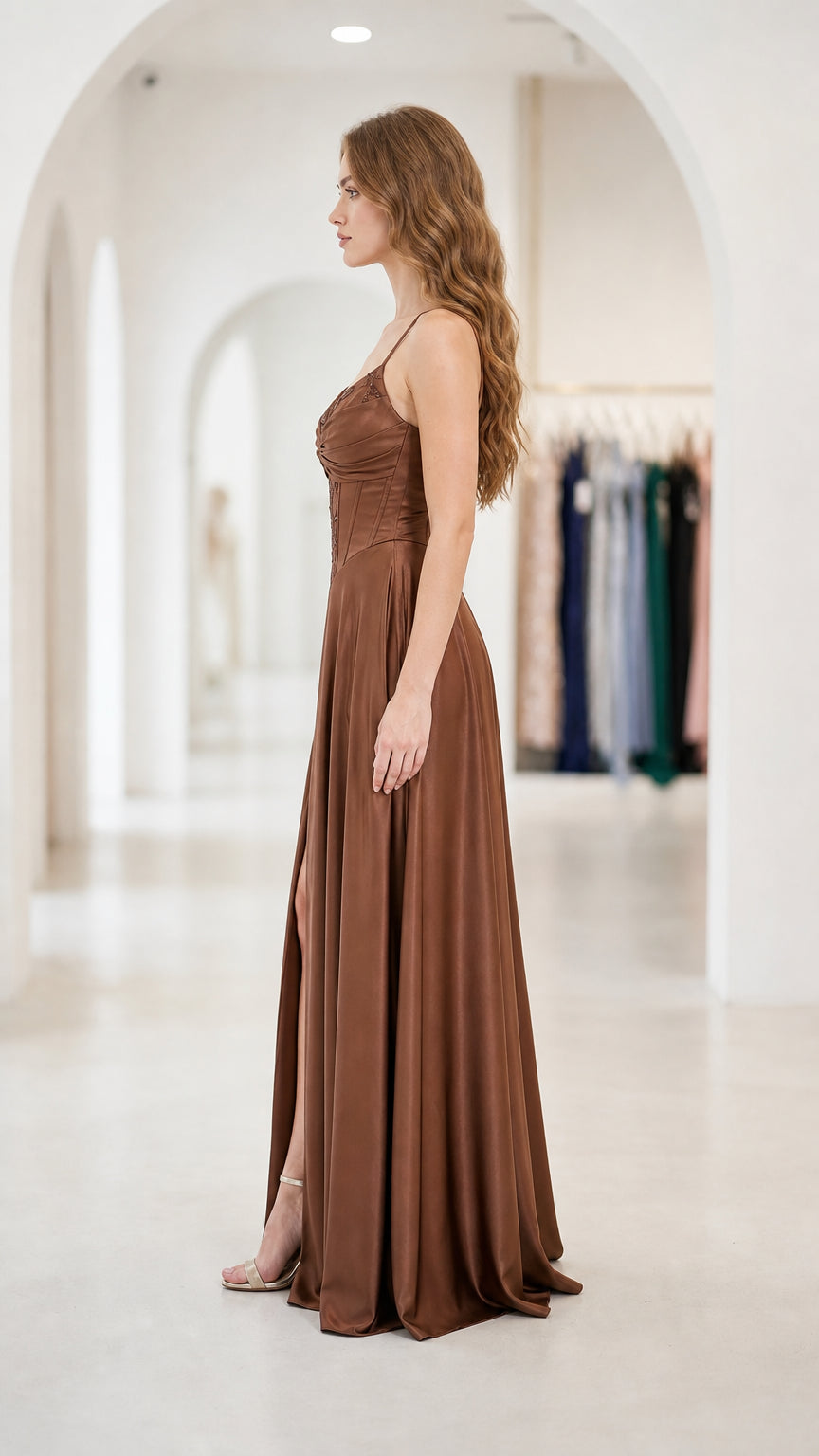 Side profile view of chocolate brown satin formal evening dress