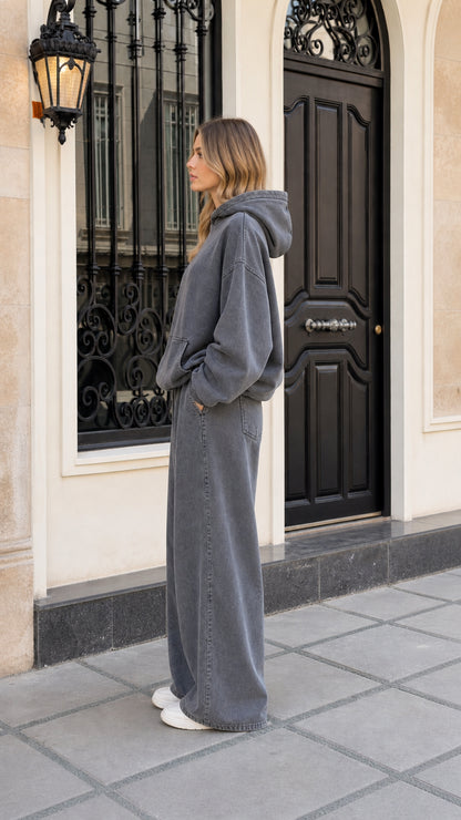Side profile view of woman wearing washed charcoal two-piece sweatpants set