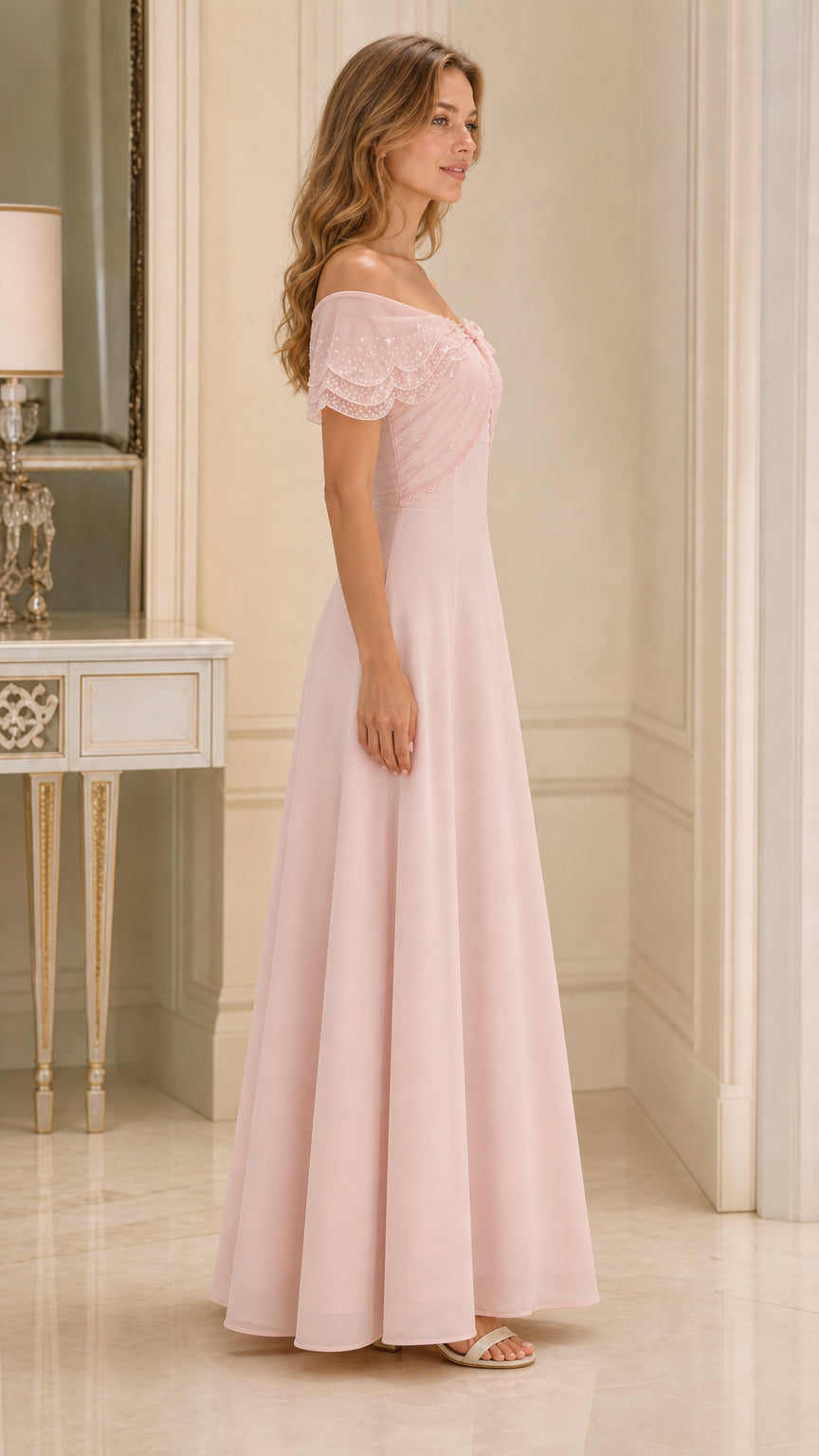 Side profile of blush pink A-line formal gown with draped capelet neckline