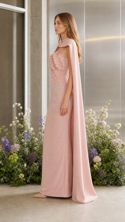 Side profile of blush pink cape evening dress showing sleek column silhouette