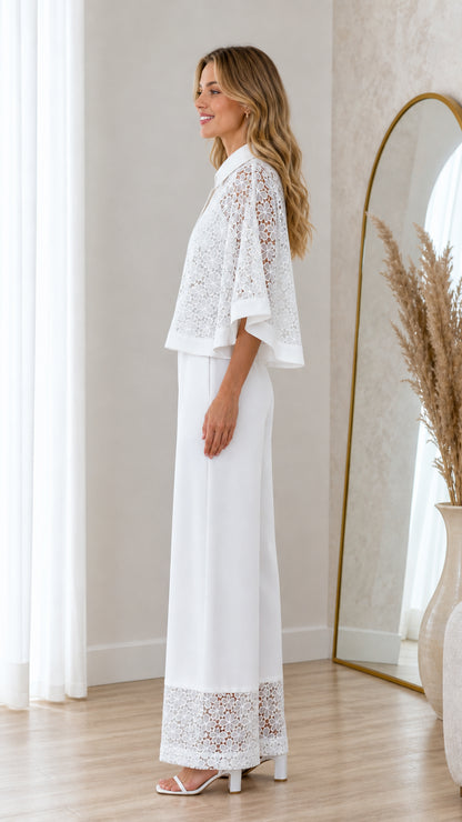 Side profile of white two piece lace capelet and trouser set