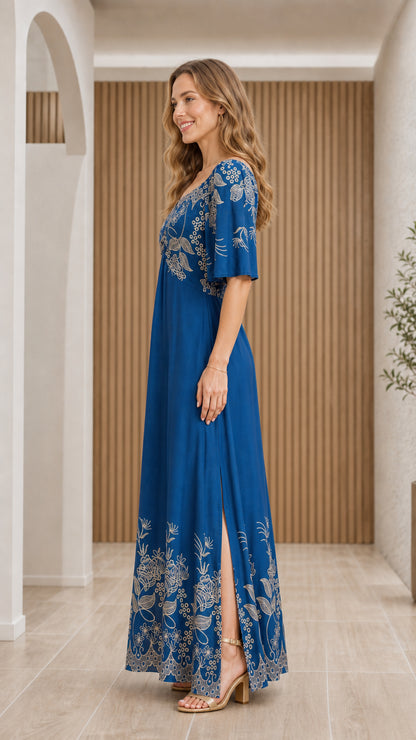 Side full-length view of Royal Blue floral embroidered maxi dress showing side slit