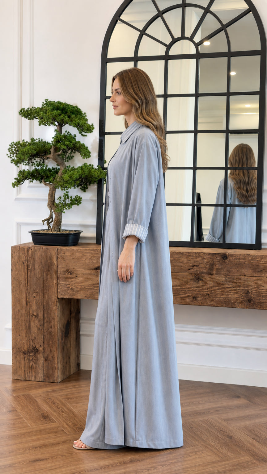 Side profile view of the light blue maxi duster coat and wide-leg pants outfit