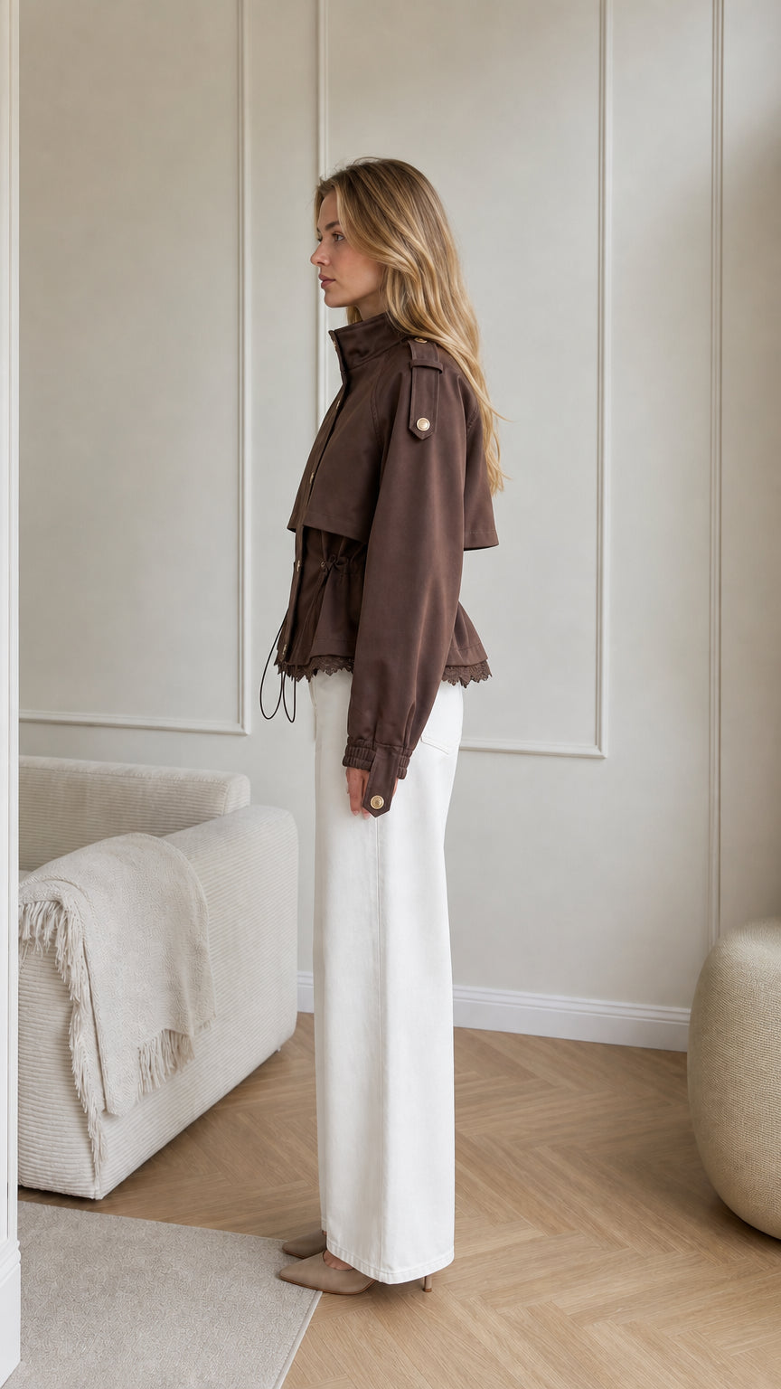 Side profile view of brown cropped cinch waist utility jacket