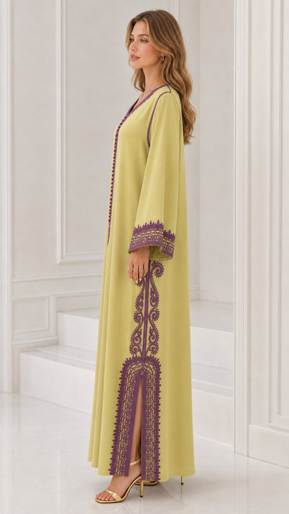 Side profile view of lime green embroidered kaftan dress showing side slit detail