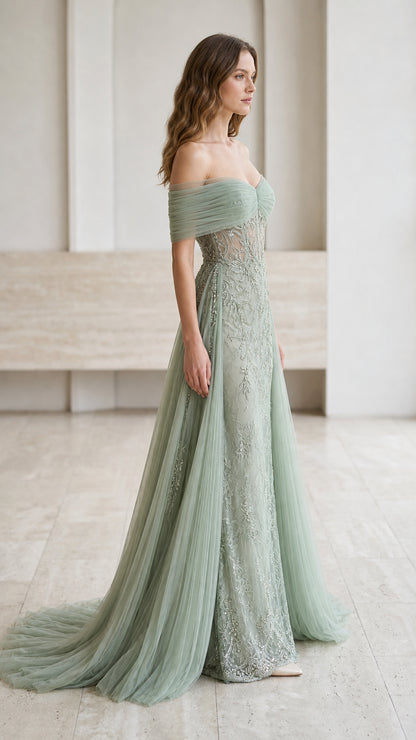 Side profile of woman in sage green embroidered formal dress with flowing tulle train