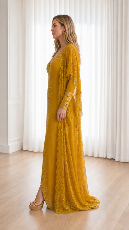 Side profile view of mustard yellow formal evening dress with lace jacket