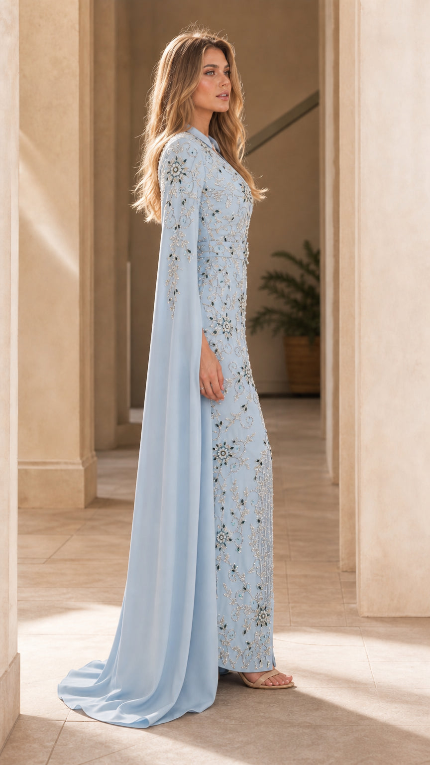 Side profile view of light blue cape sleeve formal dress