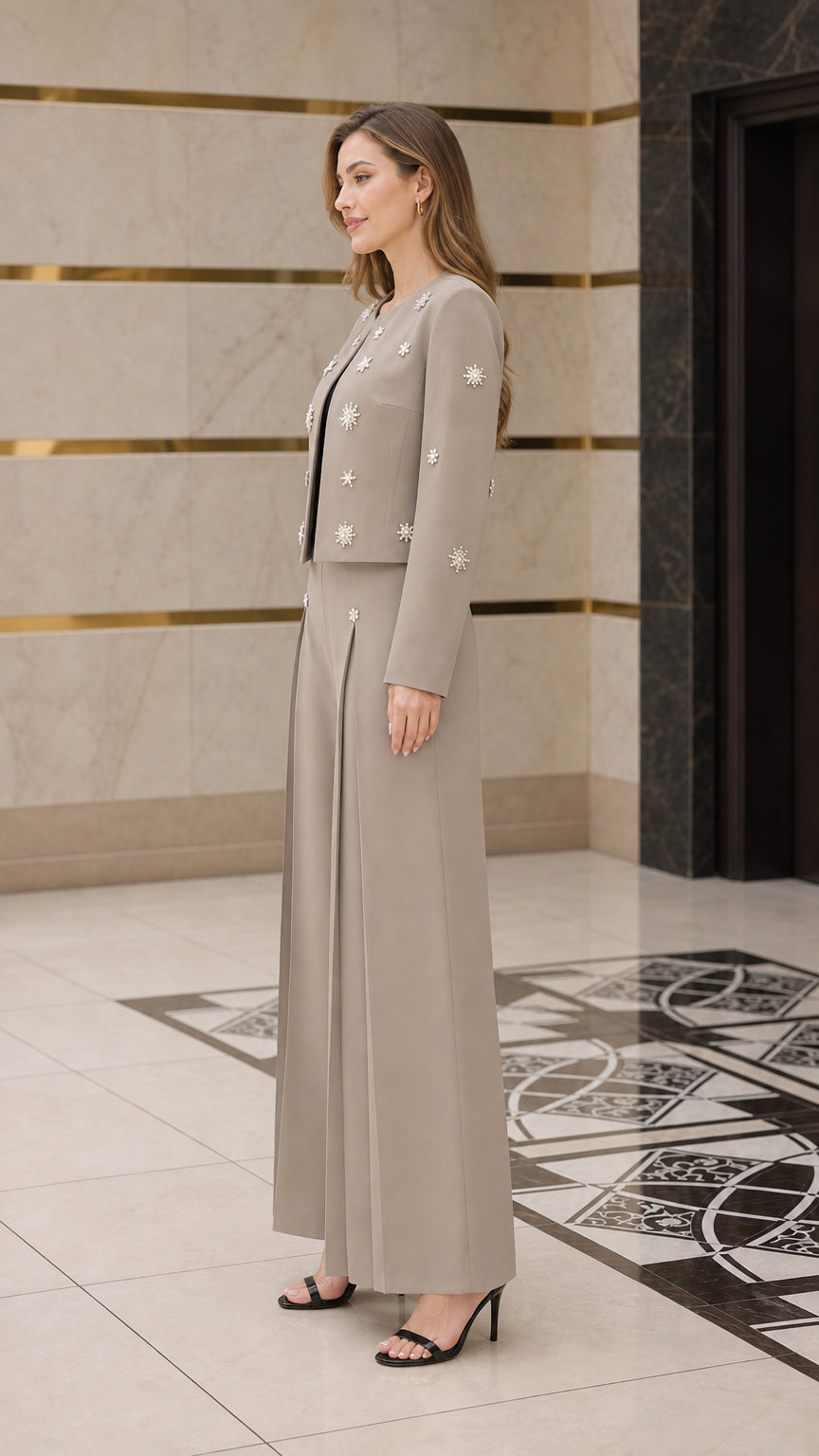 Side profile of model in taupe star-embellished formal pant suit set