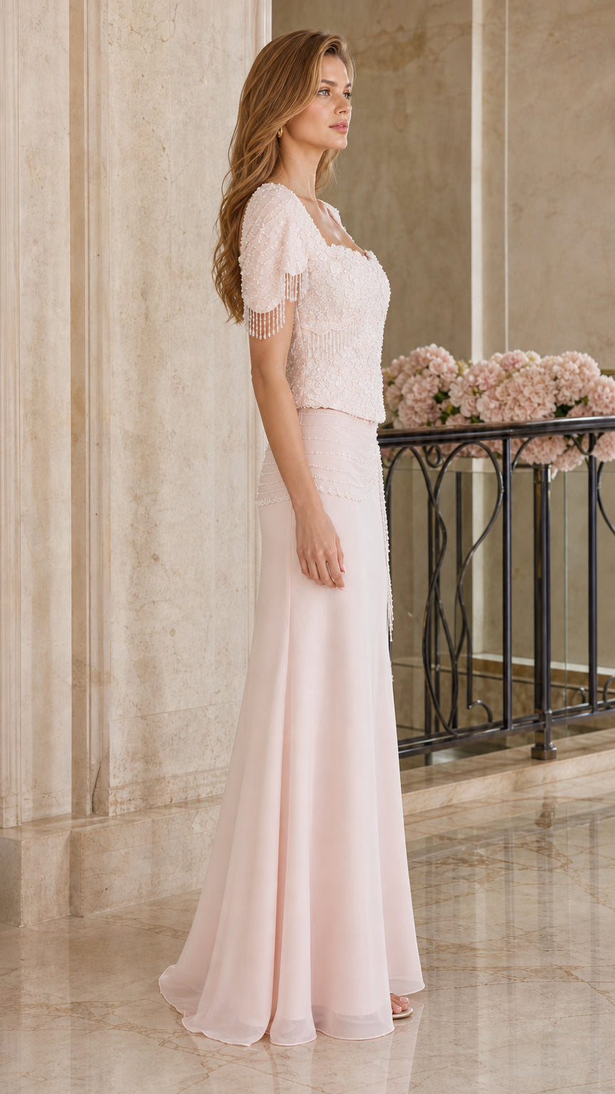 Side profile view of blush pink short sleeve beaded formal maxi dress