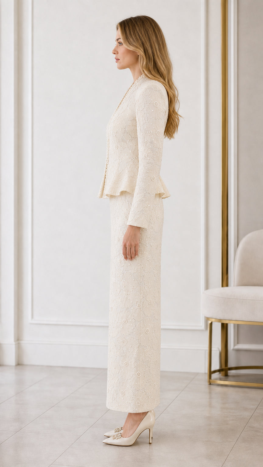 Side profile view of cream two-piece formal peplum skirt set