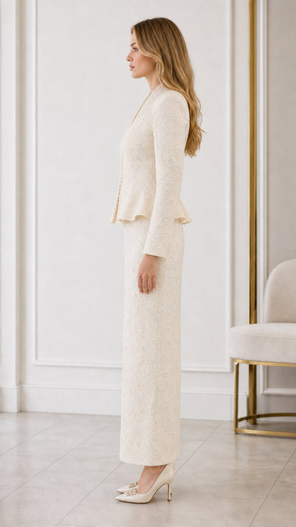Side profile view of cream two-piece formal peplum skirt set