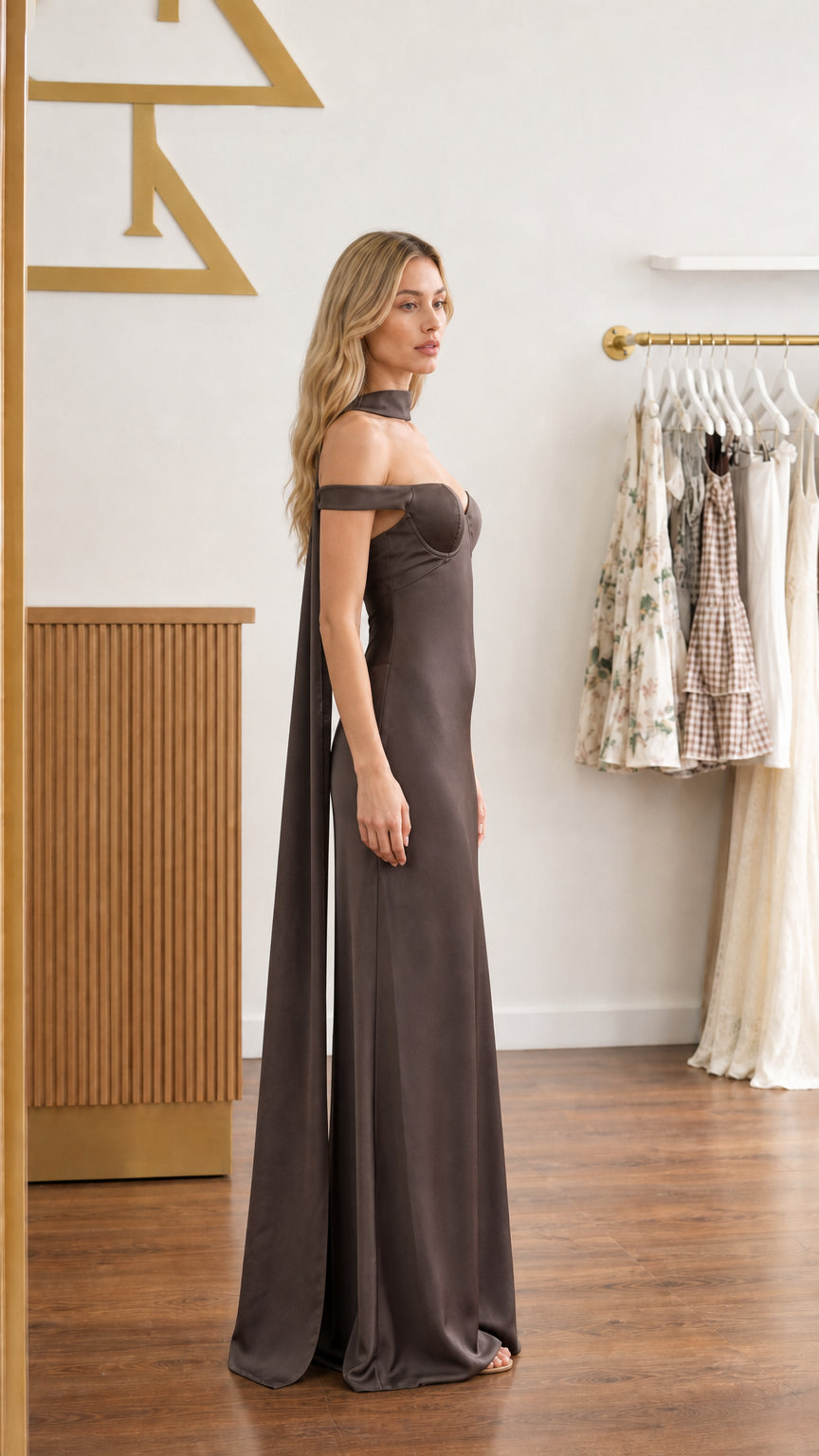 Model wearing chocolate brown satin bustier maxi dress - side view