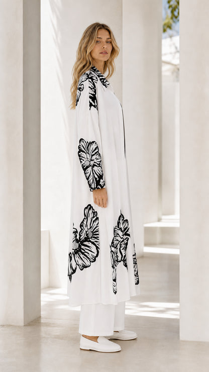 Side full view of women's white two-piece floral duster and pant set