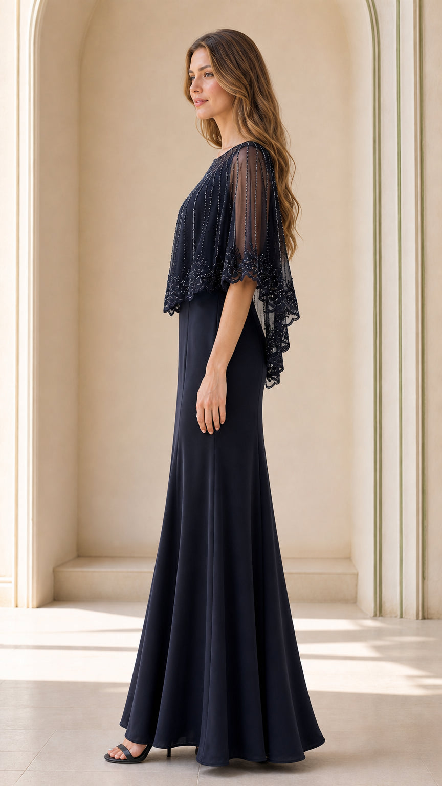 Side profile view of navy blue formal capelet gown