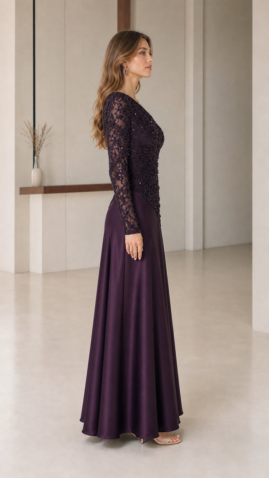 Plum formal evening gown side view showing long lace sleeves and satin drape