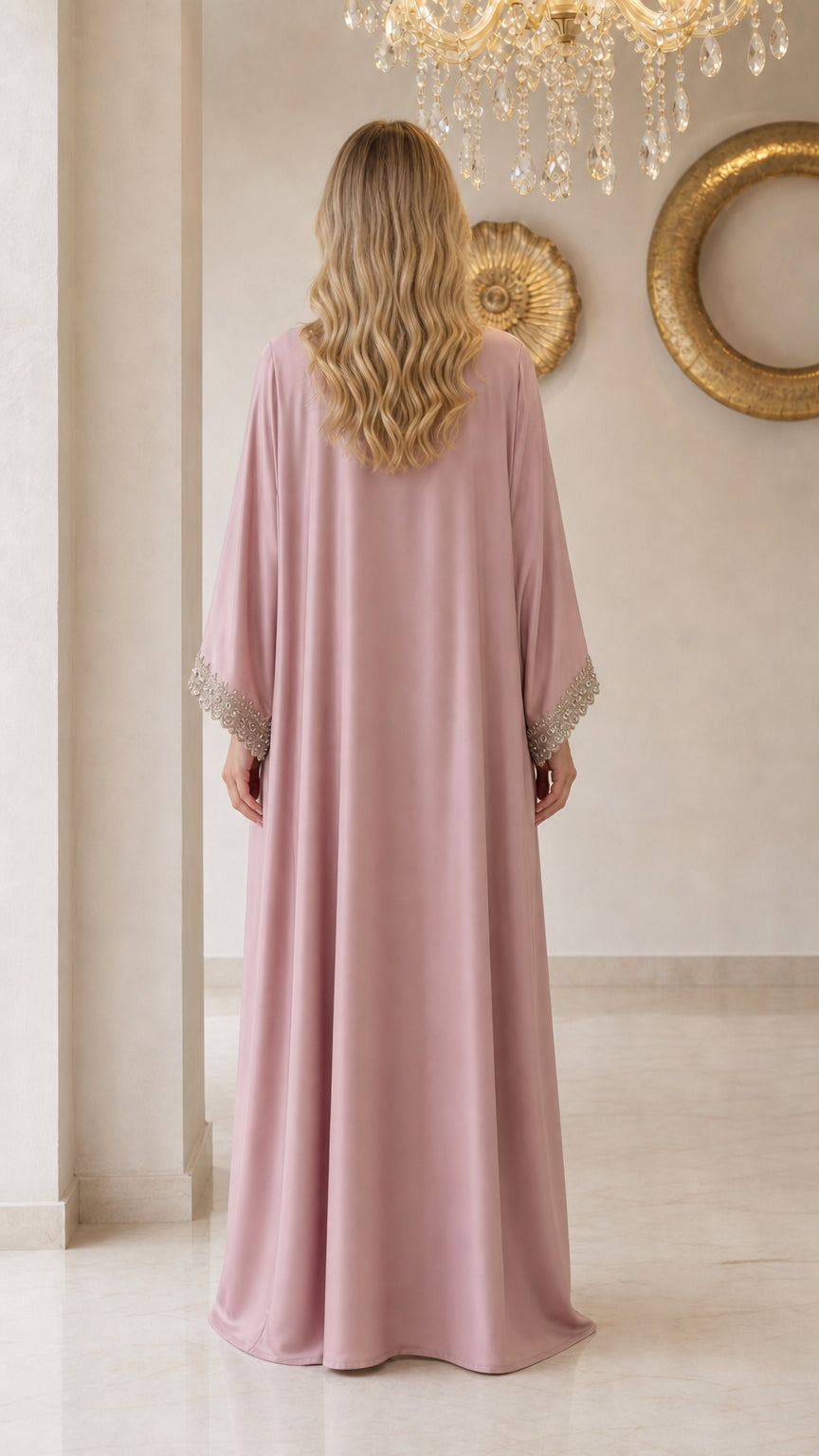 Back view of model wearing floor-length dusty pink kaftan dress