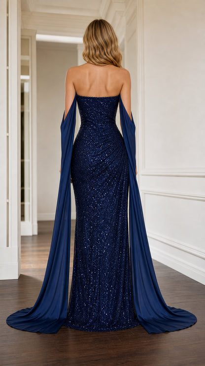 Back view of navy blue strapless sequin formal dress with elegant cape details