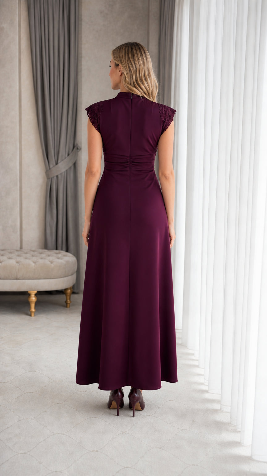 Back view of woman wearing elegant plum maxi dress