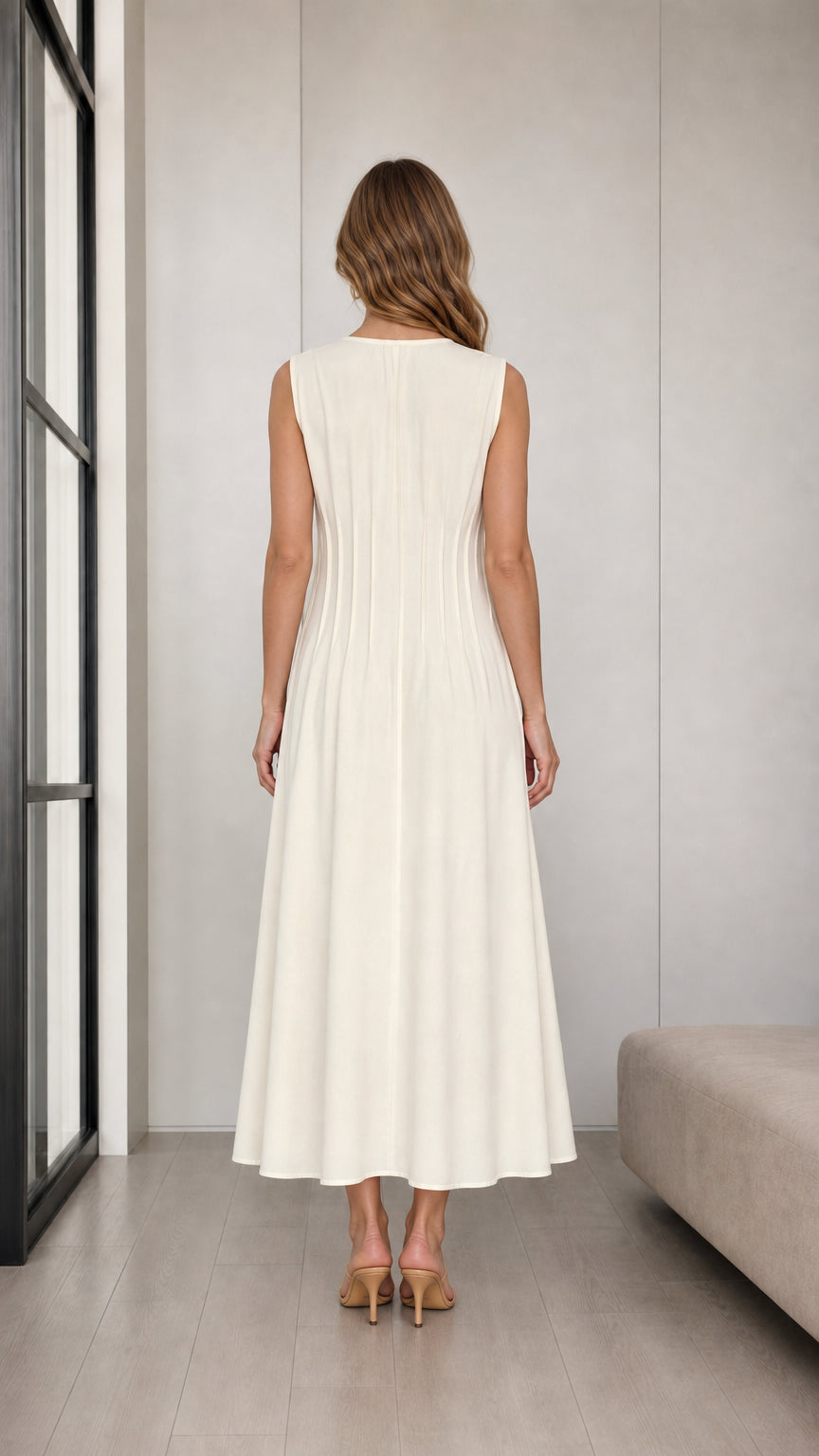 Back view of woman wearing Cream sleeveless midi dress