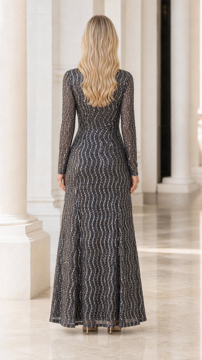 Back view of model in charcoal long sleeve sequin maxi dress