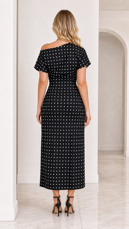 Back view of model wearing black polka dot sheath midi dress