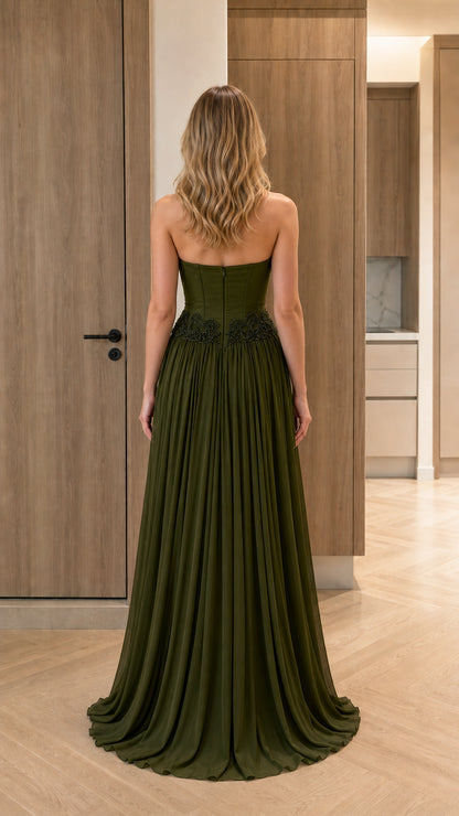 Back view of model in olive green strapless floor-length evening dress
