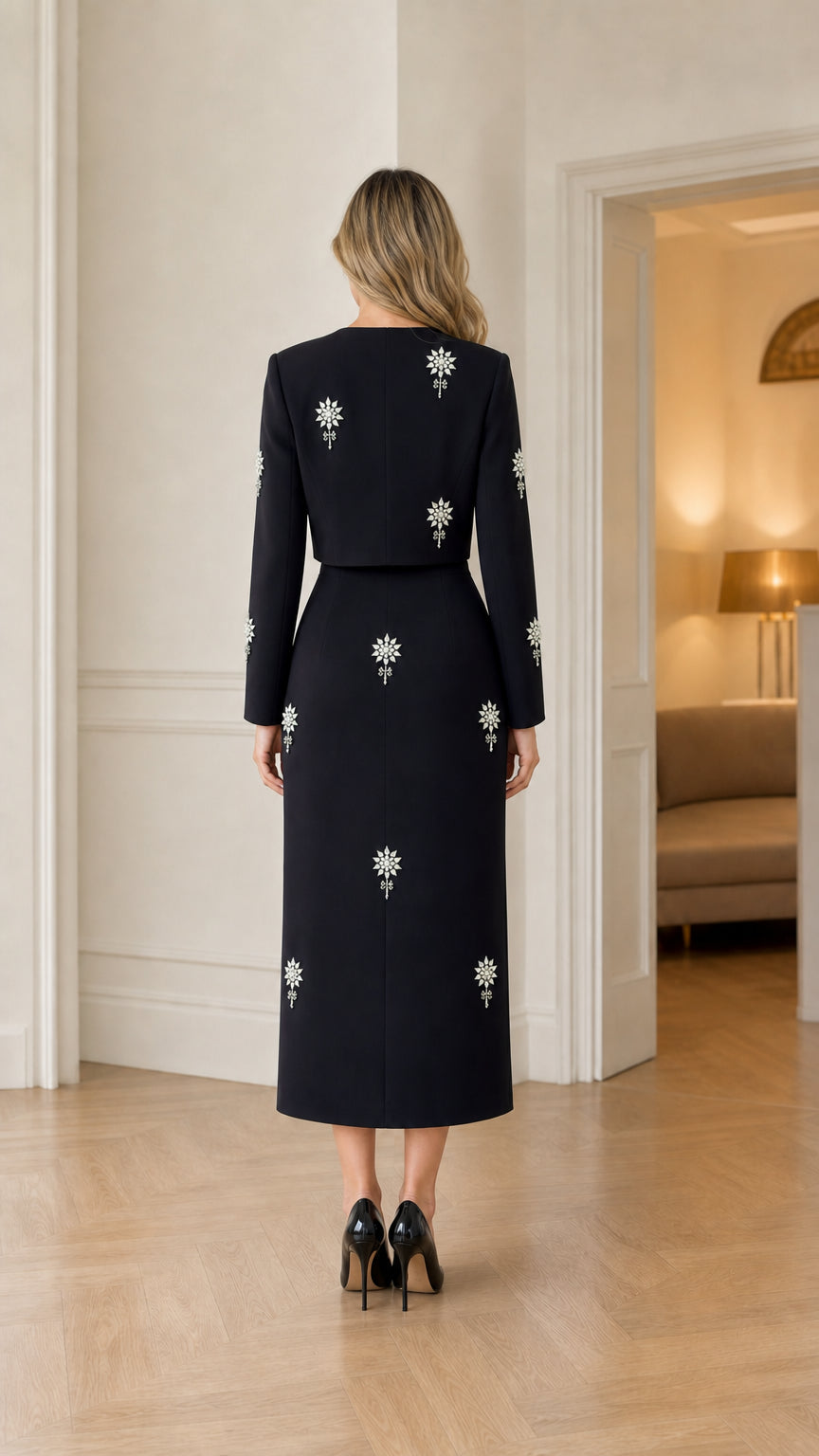 Back view of black long sleeve column evening dress