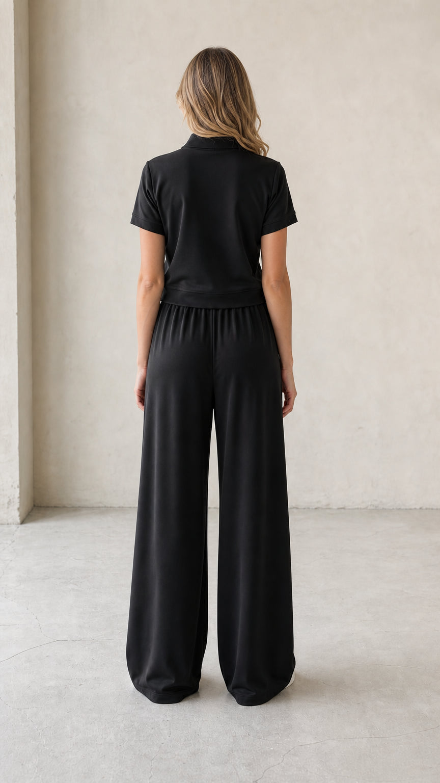 Back full-length view of black matching lounge set with wide-leg trousers