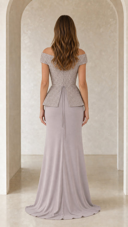 Back view of model in dusty lilac beaded off-the-shoulder gown showing skirt sweep