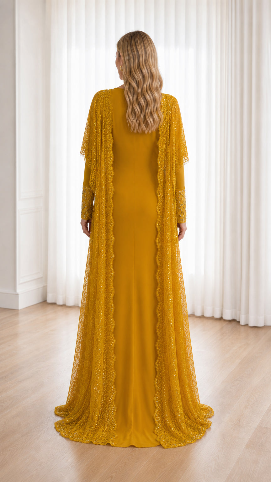 Back view of floor-length mustard yellow formal gown with flowing lace jacket