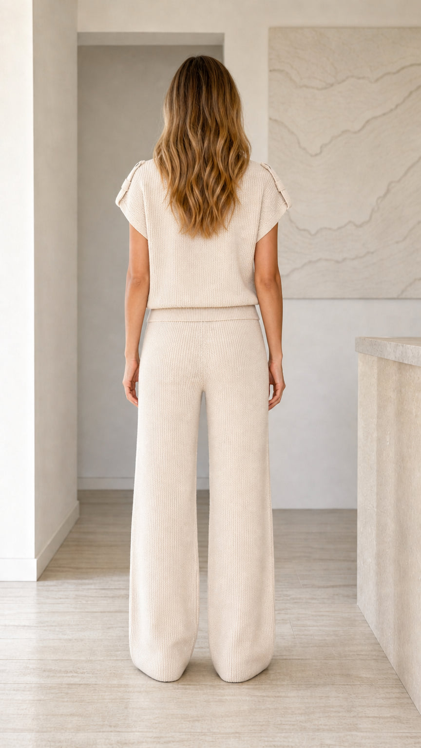 Back view of model wearing beige short sleeve ribbed knit loungewear set