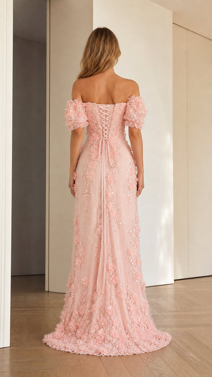 Back view of blush pink evening gown showing lace-up corset back and train