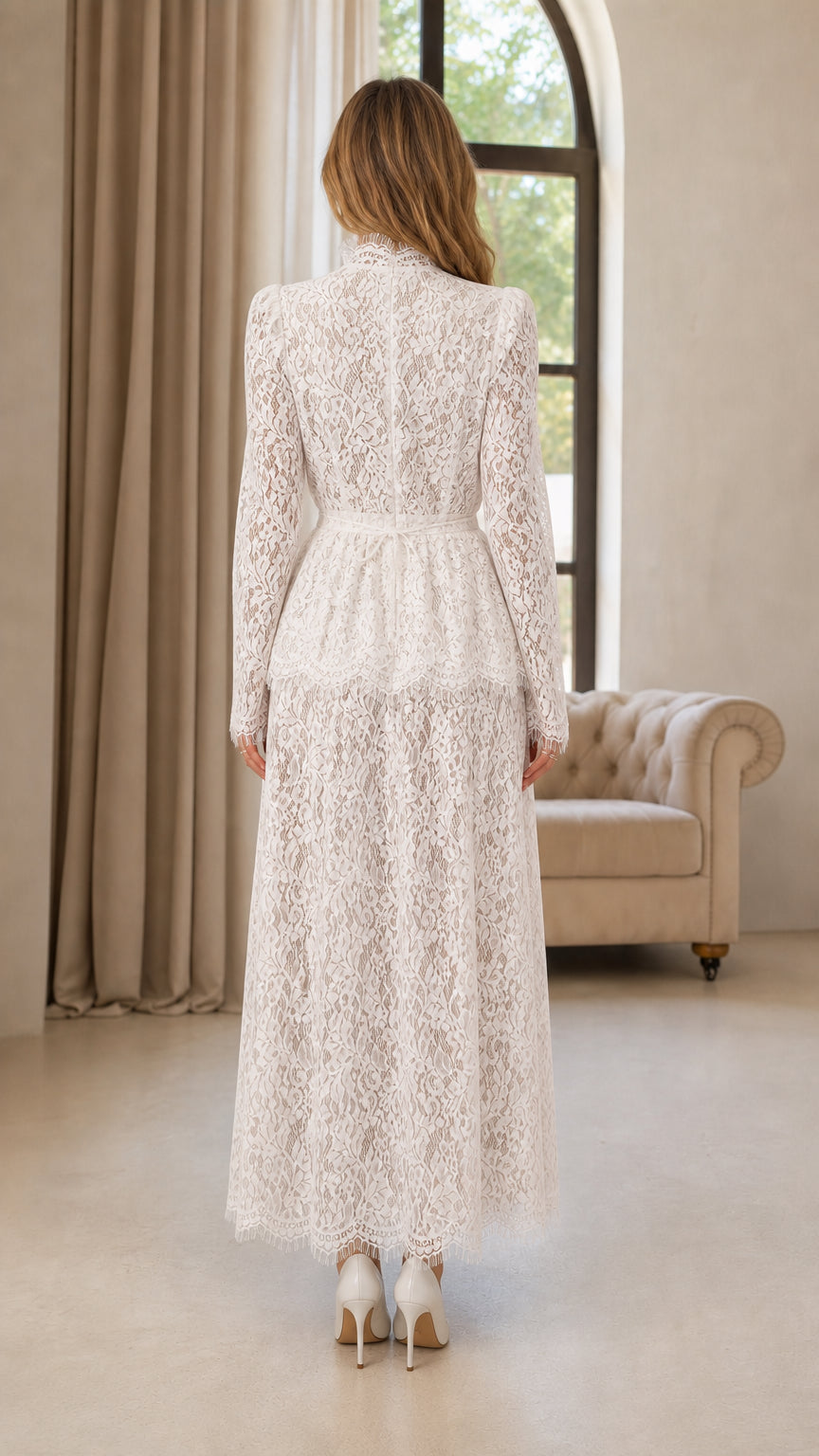 Back view of woman wearing white high neck lace evening jumpsuit