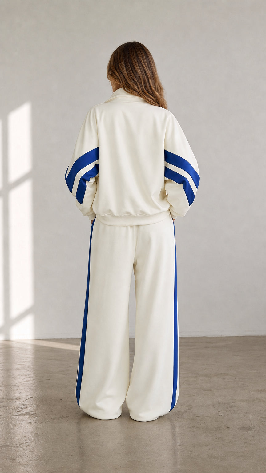 Back view of cream sporty track jacket and wide-leg sweatpants set