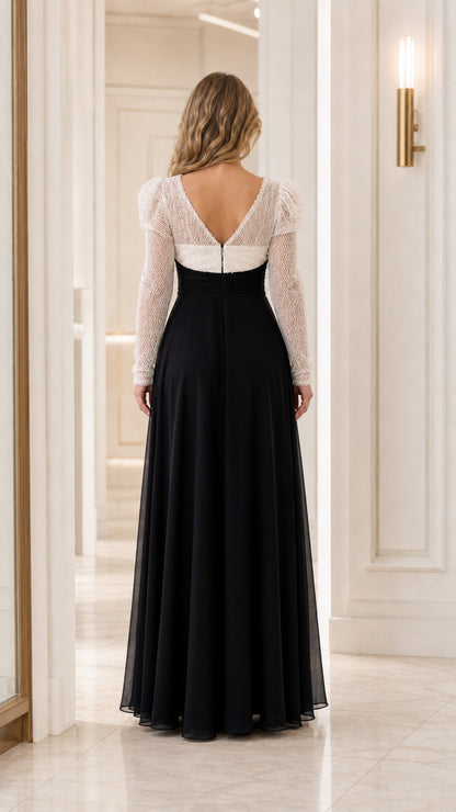 Back view of black and white V-back chiffon evening gown with long sleeves