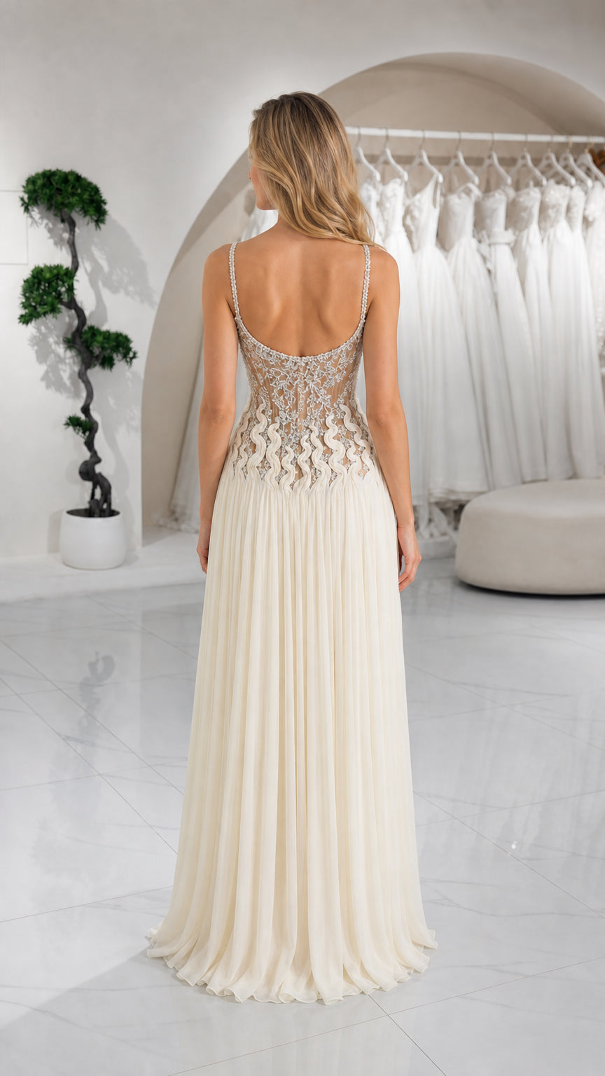 Back view of ivory evening dress showcasing low open back and spaghetti straps