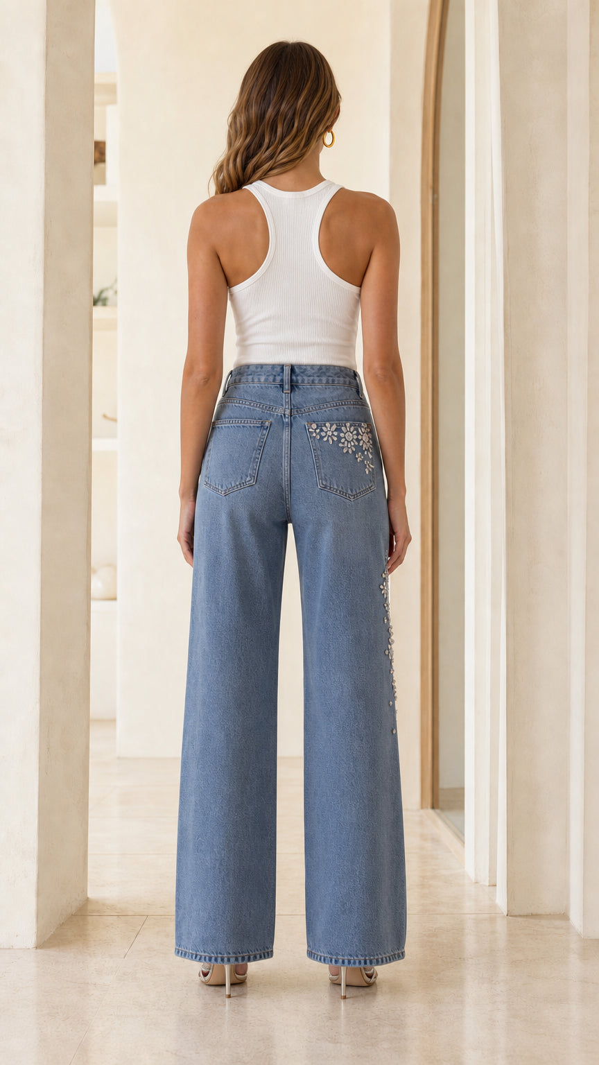 Back view of Light Blue embellished wide leg jeans showing crystal pocket detailing