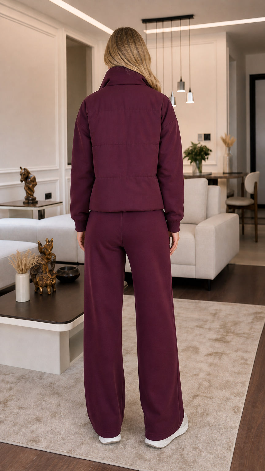 Back view of model wearing burgundy 3-piece padded vest and wide-leg pants set
